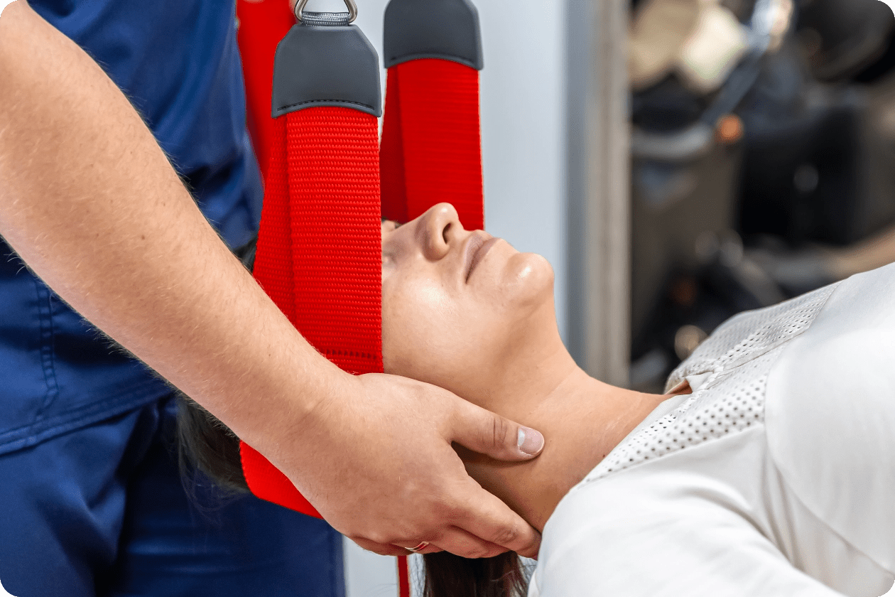 female-patient-hanging-suspensions-rehabilitation-center