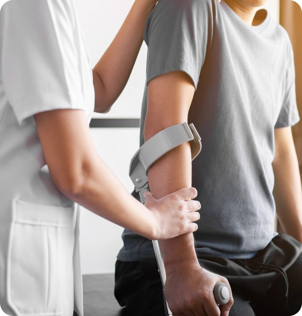 physiotherapist-women-training-with-men-patient-using-crutches-clinic-physical-therapy-concept