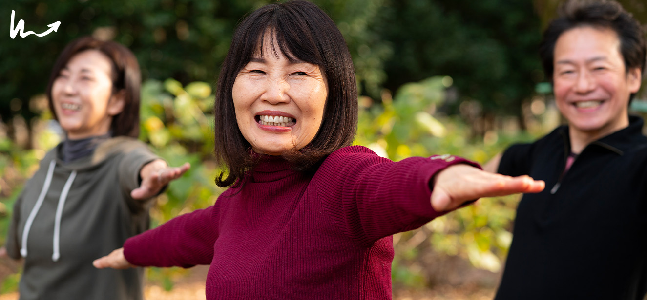 Elderly people performing daily stretching and strength training