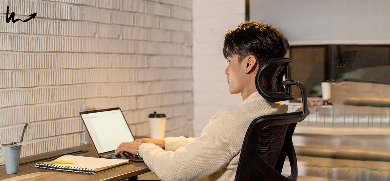 Man working comfortably in an ergonomic office chair.